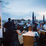 Guests during Rhode Island Distributing’s Scotch event on the rooftop at Hotel Viking.