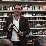 Baracchi prepares to present his Tuscan wines to guests at the Crushed Grape in Milford.