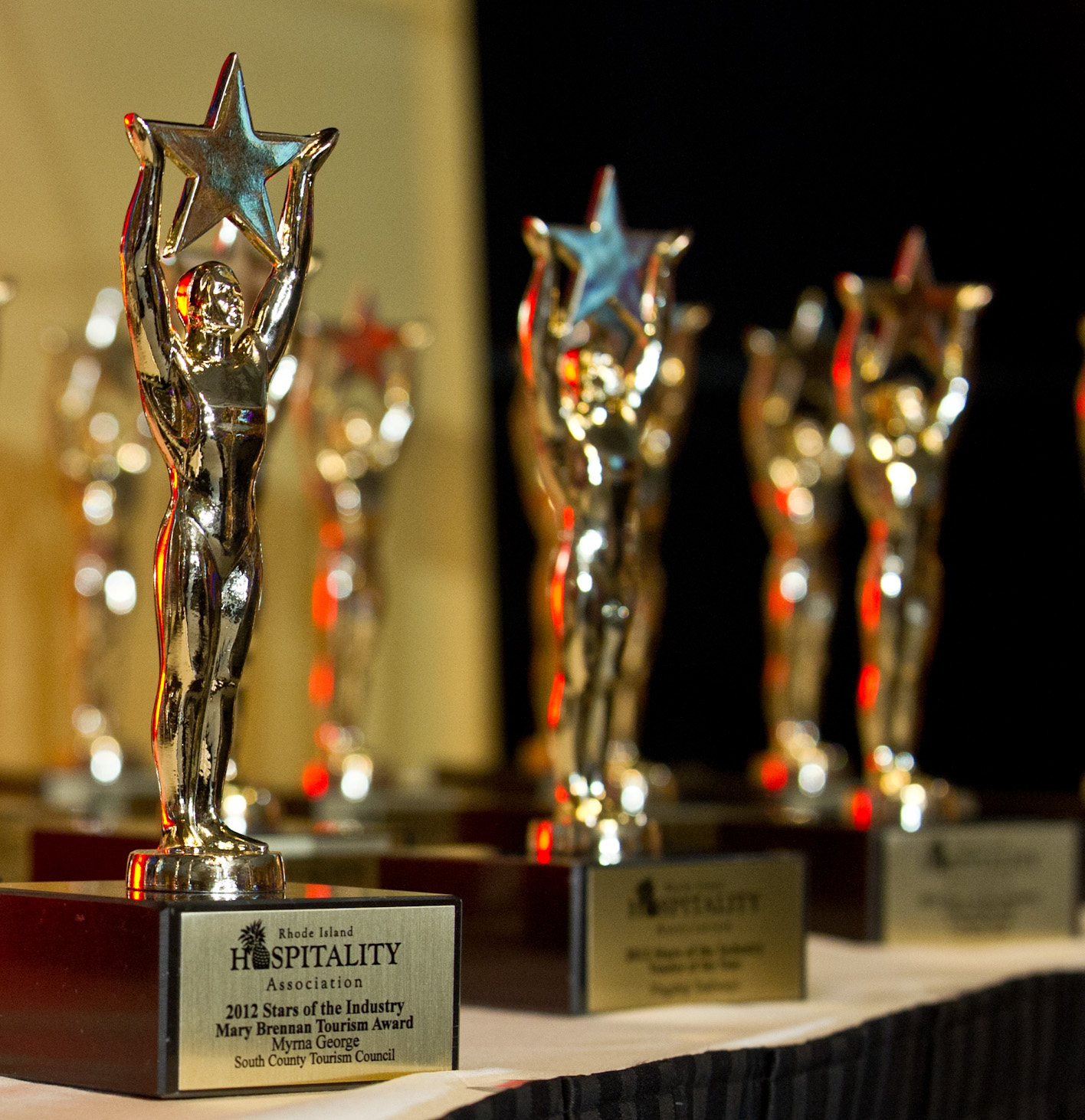Custom-made star trophies line the award table at the 2012 RI Hospitality Association’s Stars of the Industry event held at the Rhode Island Convention Center.
