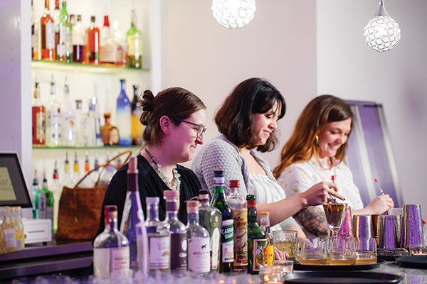 Bartenders Elizabeth Sawtelle of Nick’s on Broadway, Jen Davis of The Eddy and Kayleigh Speck of Durk’s Bar•B•Q and The Grange create cocktail pairings for Dinner by Dames held at Skyline at Waterplace.