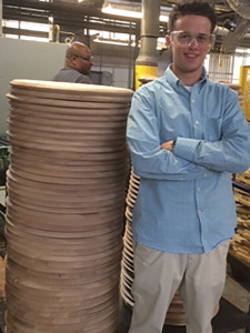 Brendon Mahony measures up to a stack of barrel tops at Brown Forman Cooperage, the only company that makes their own bourbon and Tennessee whiskey barrels. The Eder Bros. group was the first ever to get a tour of the factory to witness the elaborate process that goes into crafting these barrels.