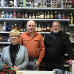 Owner Charles Kelly (center) with employees Victoria and Paul