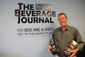 John Maguire, Sales Representative, Ace Distributing with The Infinite Monkey Theorem canned wines. 