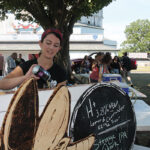 Jessica Rubin of Firefly Hollow Brewing in Bristol pouring beers for guests.