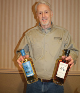 David Baker, Owner, Litchfield Distillery with its newest releases, Barrel Finished Gin and Vanilla Bourbon.