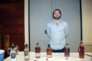 Alex Schlien, Merchandiser, Slocum & Sons showcasing Pendleton Whiskey, Trail’s End and Big Gin.