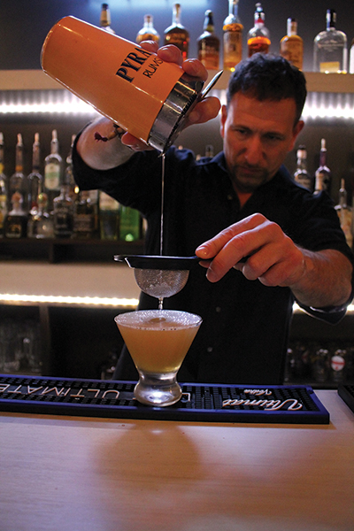 Rob Martini, Bar Manager, Camps, mixing the “Angry Canadian Mountie.”