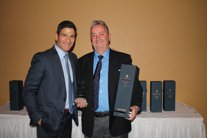 Gene Sepe, CEO/President, Brescome Barton awards Don Cameron, Sales Representative, Brescome Barton with the “2016 Top Sales Rep” for the Johnnie Walker Presidents Club.