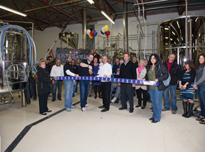 Overshores Brewing Co. founder and president Christian Amport cuts a ceremonial ribbon with East Haven Mayor Joe Maturo and members of the East Haven Chamber of Commerce. Photo by Jennifer Higham Photography, Courtesy East Haven Chamber of Commerce.  (Jennifer Higham Photography)