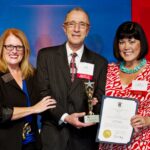 Lisa Doucet-Albert, Sr. Vice President of Regan Communications Group, accepts the 2012 President’s Award. Left to right RI Hospitality Association’s President and CEO, Dale Venturini; Incoming RIHA Chairman of the Board, Angelo DePe