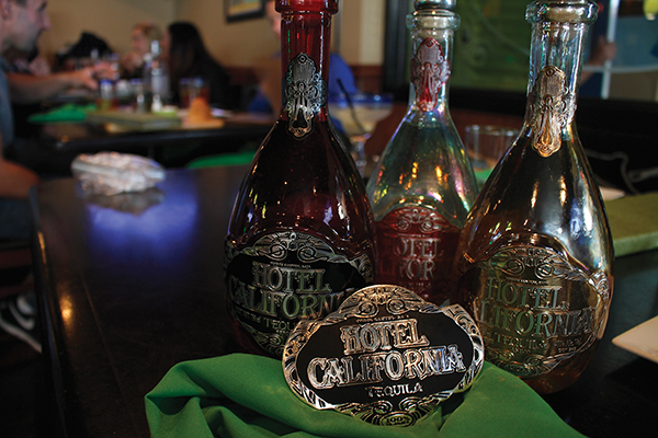 Hotel California Tequila bottles and the grand prize belt buckle. Each bartender had seven minutes to craft a cocktail using Hotel California Tequila.