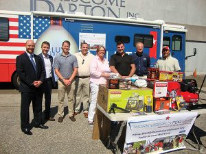 Mike Heins, Trade Development Manager, Brescome Barton; Ryan Dunne, Salute American Vodka; Michael Lutz, Salute American Vodka; Frank Gaglio, Work Vessels for Vets; Cathy Cook, Executive Director, Work Vessels for Vets; Veteran U.S. Navy Petty Officer James Wright; John Niekrash, Chairman, Work Vessels for Vets; Scott Sweitzer, Salute American Vodka. 