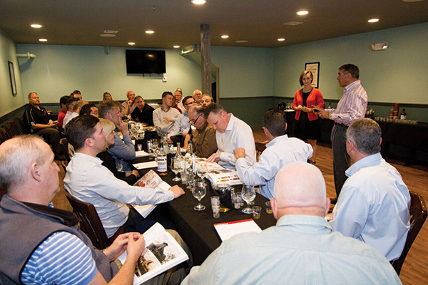 Kelly McCarthy. Brand Development Manager, Anchor Distilling Co., with Angelo Collins, President, Horizon Beverage Co. of Rhode Island, leading a discussion on the Anchor Distilling spirit portfolio.