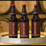 Barrel Aged Battle Cry Belgian Tripel Ale is aged in Battle Cry Single Malt Whiskey oak barrels. The beer is not carbonated and “drinks like a brandy with heavy barrel influence,” 15.85% ABV.