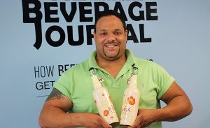 Darchell Wilson, Sales Representative, Latitude Beverage, with Mija White Sangria.