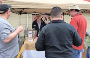 Kas Katinas, Co-founder, Kas Spirits speaking with guests at the Little Poland Festival in New Britain on April 30. 