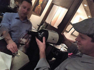 Michael Munk, Regional Sales and Portfolio Manager CT/NY/NJ, Latitude Beverage, pouring from a 3-liter limited edition bottle of Magic Door Rosso, a super Tuscan blend.