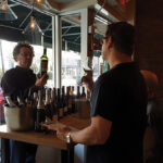 Steve Wynn, Owner, Wine Bros., pouring for Steve Patterson of Metacom Kitchen in Warren.