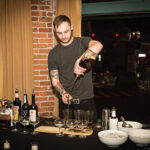 Greg Mayer mixing his winning cocktail.